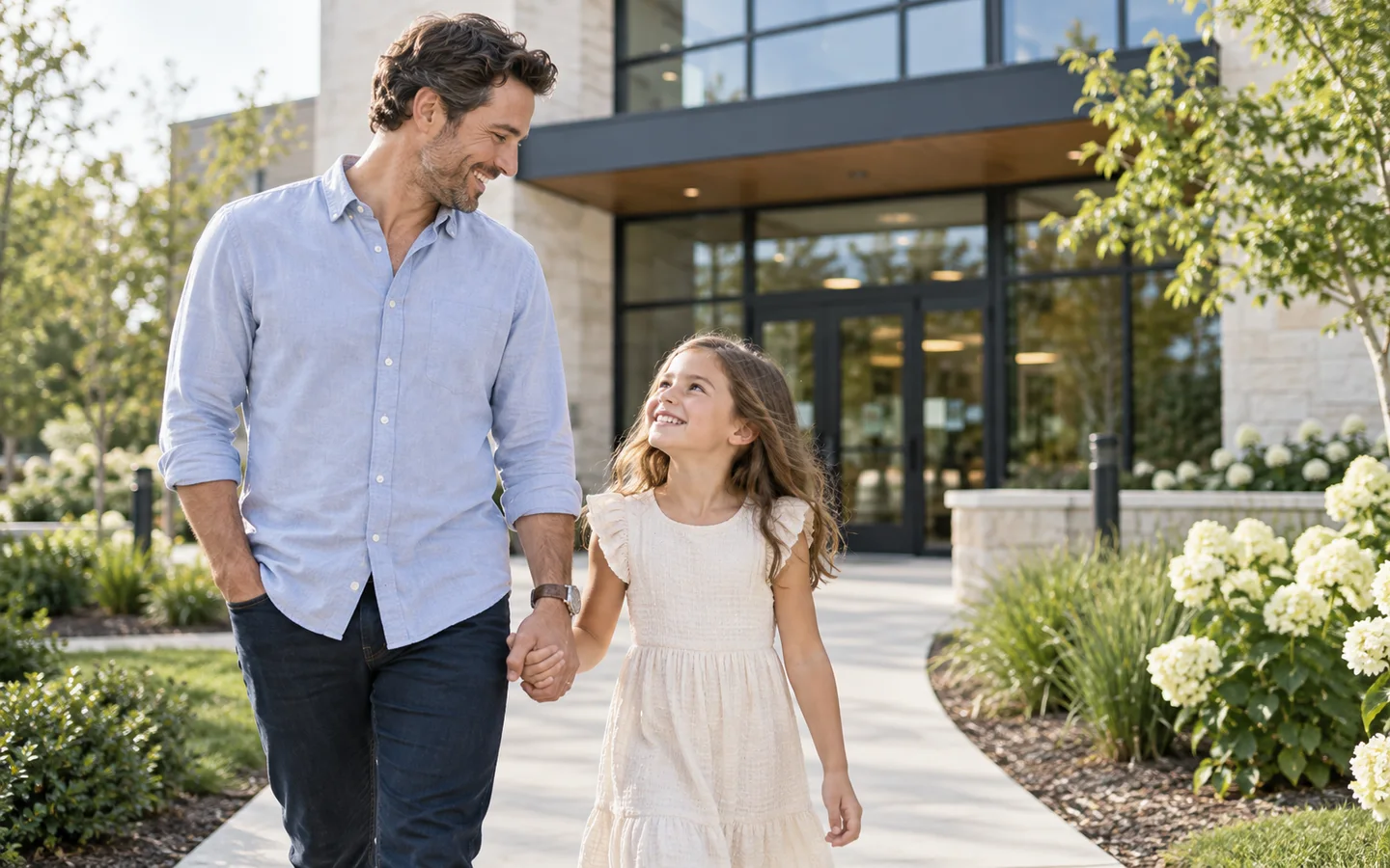 Father and daughter walking together outdoors