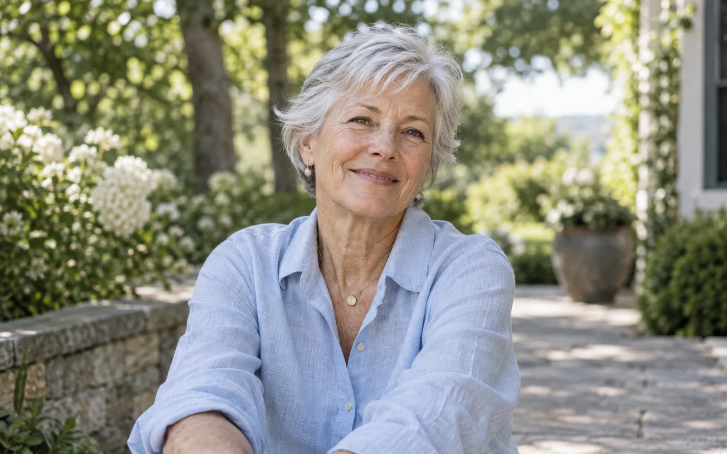 Older woman smiling in a garden