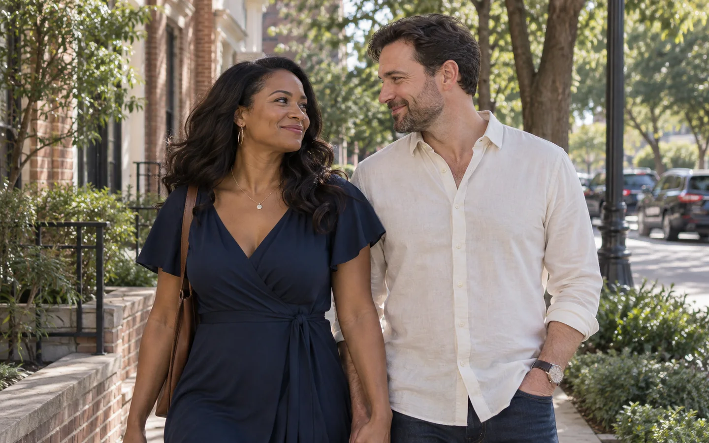 Couple smiling together on a neighborhood walk