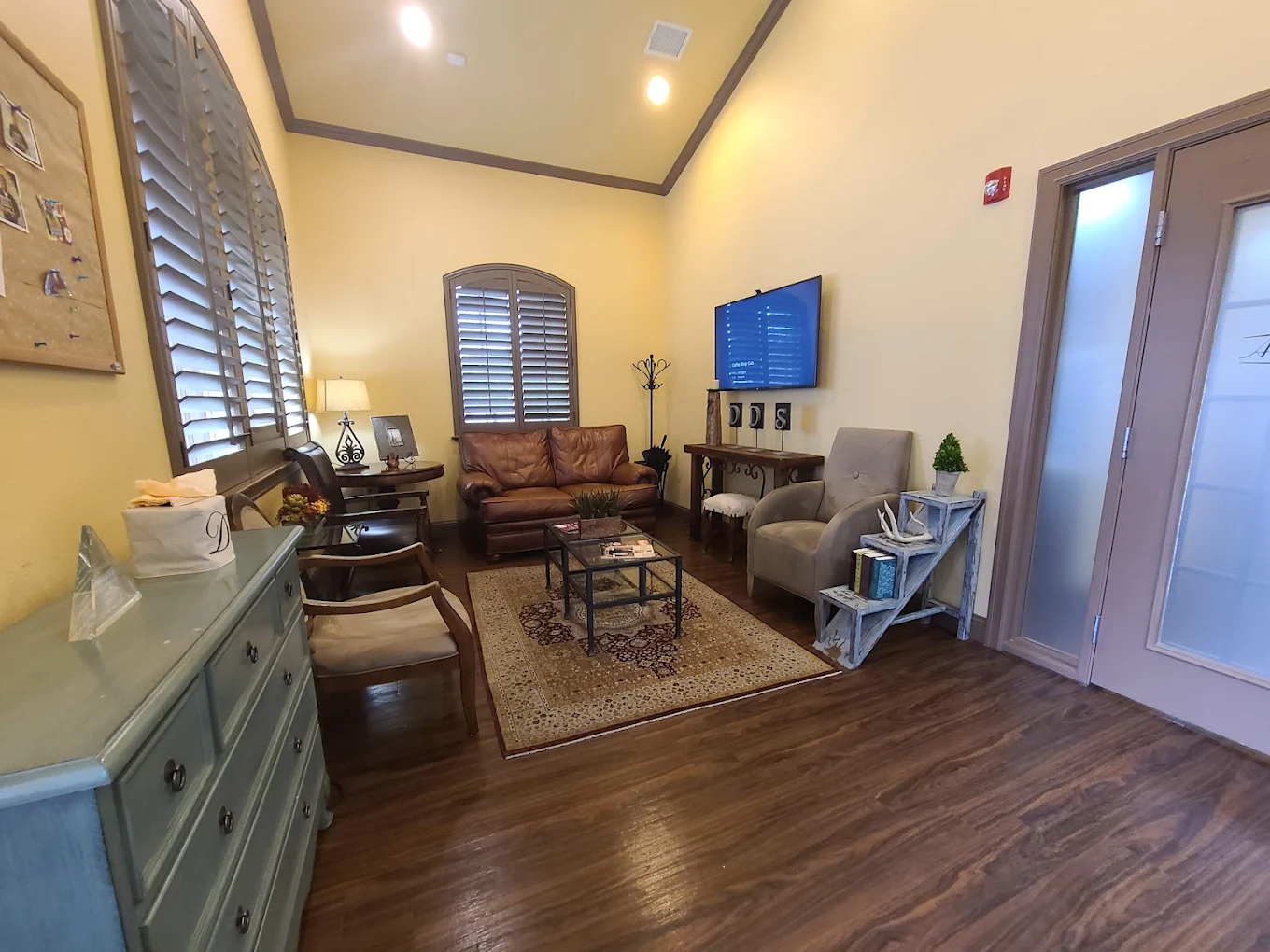 Patient lounge with comfortable seating at Advanced Smiles