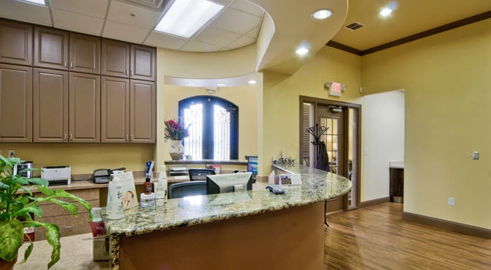 Reception desk and entryway at Advanced Smiles